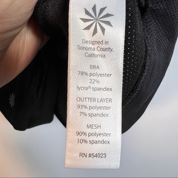 ATHLETA Black Top with built in bra. Floral side panels open underarms. Size M - Picture 2 of 8